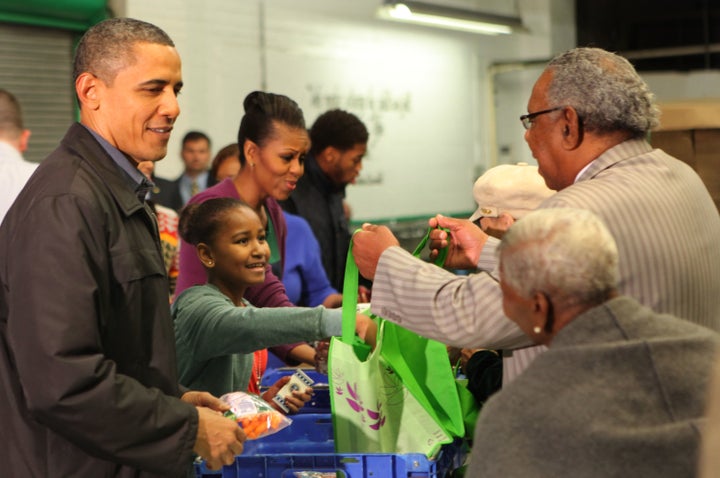 The Obamas handed out food packages at the Capital Area Food Bank in 2011.