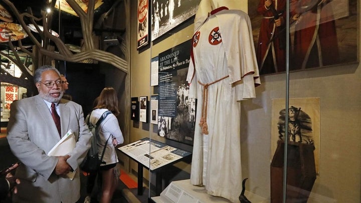 Lonnie Bunch, founding director of the National Museum of African American History and Culture, looks at a Ku Klux Klan display in the new Mississippi Civil Rights Museum in Jackson last April. African-American museums and historic sites are flourishing amid increasing interest in black history. 