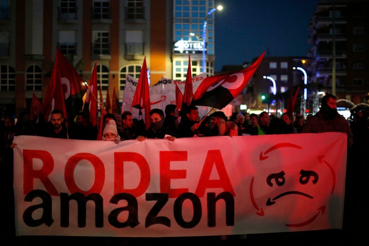 People rally in Torrejon Ardoz, Spain, on Friday amid a two-day strike over a labor dispute with Amazon. 