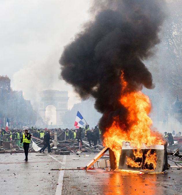 Protestors clash with police near the Arc de Triomphe in Paris.