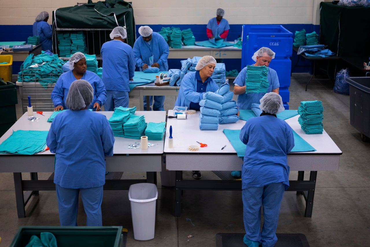 Tyimka Thomas, center, works at Evergreen Cooperative Laundry.