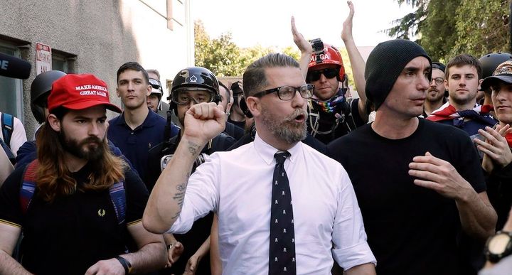 Gavin McIness (center) claims he has quit the Proud Boys, the gang he founded, just as they were revealed to be labeled an extremist group by the FBI.