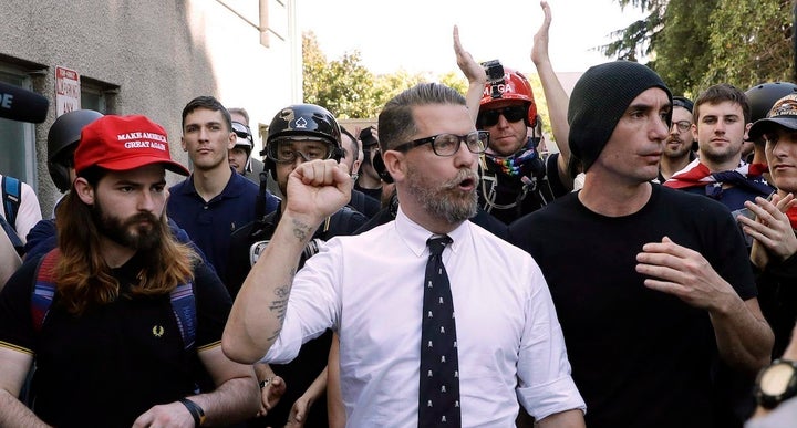 Gavin McIness (center) claims he has quit the Proud Boys, the gang he founded, just as they were revealed to be labeled an ex