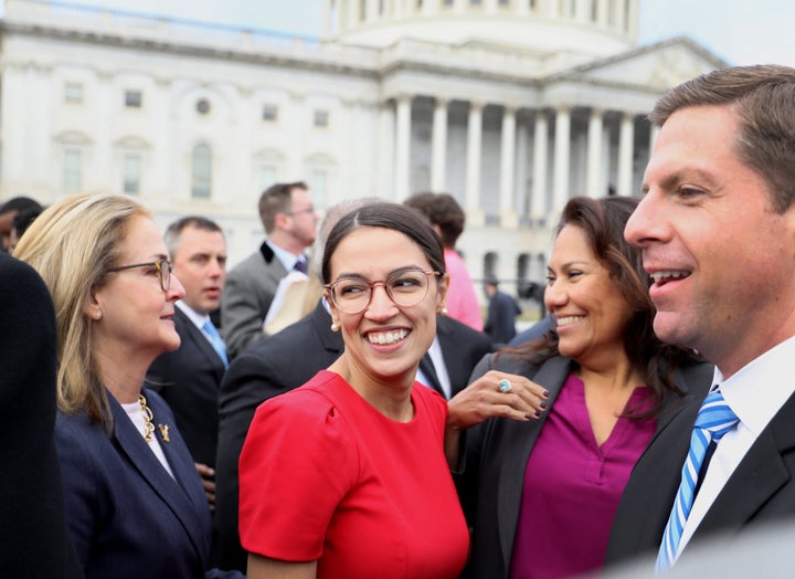 Rep.-elect Alexandria Ocasio-Cortez, a Democrat from New York, smiles after a group photo with the 116th Congress outside the U.S. Capitol on Nov. 14, 2018.