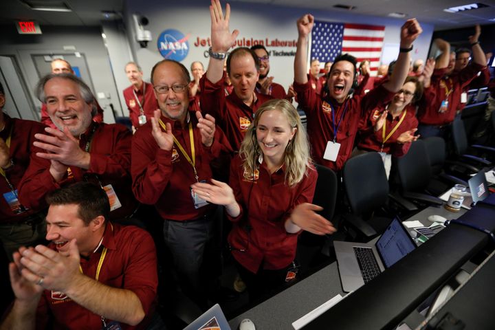 Engineers at the Jet Propulsion Laboratory celebrate. 