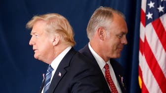 U.S. President Donald Trump walks past Interior Secretary Ryan Zinke as he stands to address the 17th annual September 11 observance at the Flight 93 National Memorial near Shanksville, Pennsylvania. REUTERS/Kevin Lamarque