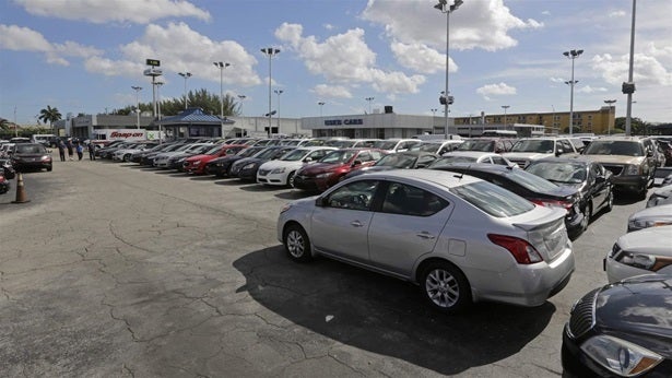 <p>Used cars for sale at a Florida dealership. Many “buy here, pay here” car dealers use starter interrupt devices called “kill switches” that will turn off the car if the owner misses a payment.</p>