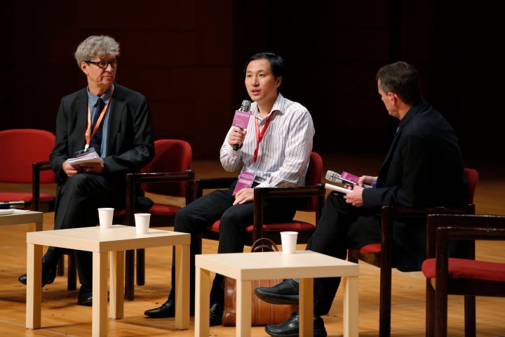 He Jiankui, a Chinese researcher, center, speaks during the Human Genome Editing Conference in Hong Kong, Wednesday, Nov. 28,