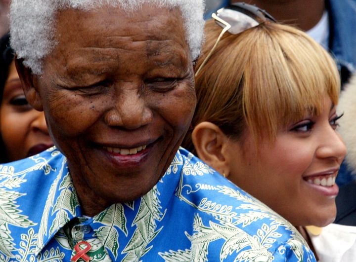 Nelson Mandela and Beyoncé visit Robben Island Prison in Cape Town, South Africa, in 2004.
