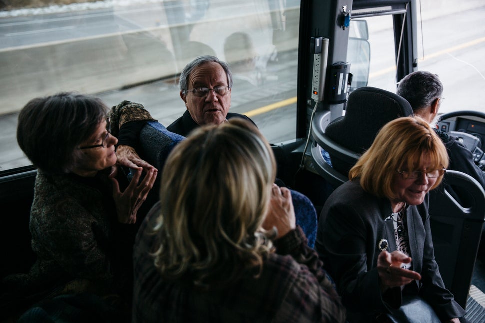 Gary Benjamin and Melody Hart talk with others on the bus ride from Ohio to the U.S. District Court in Ann Arbor, Michigan.