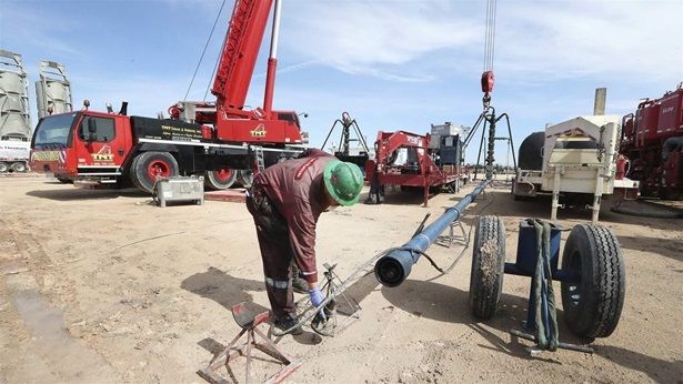 Employees work at a fracking site in Texas. Fracking requires large volumes of water but is often used in dry climates.
