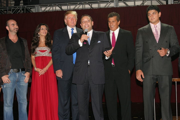 Felix Sater (center, holding the microphone) attends a launch party for the Trump Soho Hotel Condominium in Manhattan on Sept