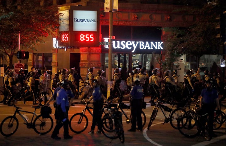 In this Sept. 17, 2017, file photo, police gather as demonstrators march in response to a not guilty verdict in the trial of former St. Louis police officer Jason Stockley.