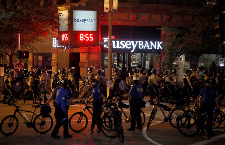 In this Sept. 17, 2017, file photo, police gather as demonstrators march in response to a not guilty verdict in the trial of former St. Louis police officer Jason Stockley. 