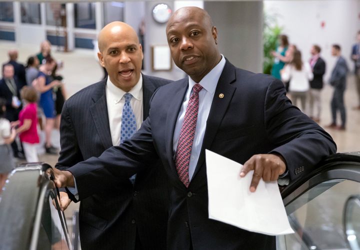 Sen. Tim Scott (R-S.C.), right, shown Aug. 23 at the Capitol with Sen. Cory Booker (D-N.J.), just sank President Donald Trump's judicial nominee Thomas Farr.