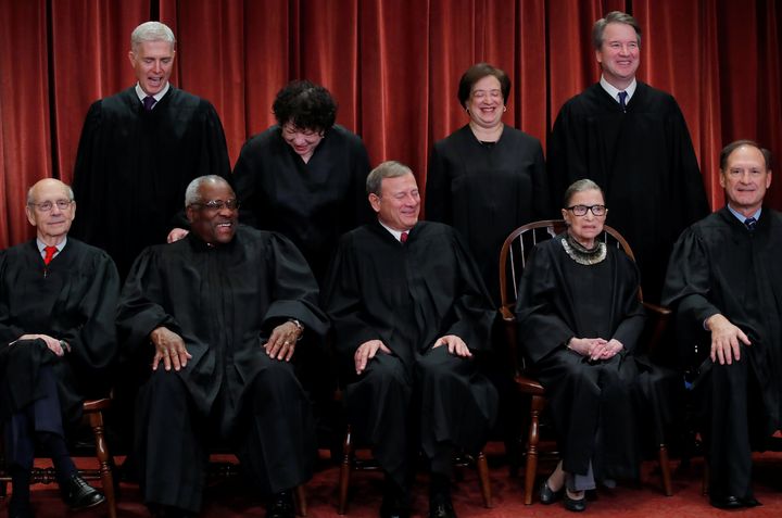 Standing in the top row are Associate Justice Neil Gorsuch, Associate Justice Sonia Sotomayor, Associate Justice Elena Kagan and Associate Justice Brett Kavanaugh. 