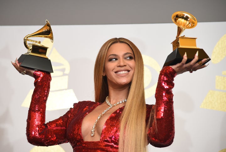 Beyoncé poses with her Grammys in the press room during the 59th Annual Grammy Awards on Feb. 12, 2017.