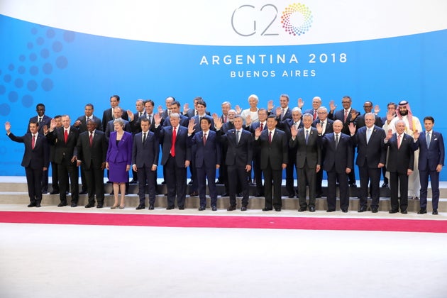 Theresa May joined other world leaders for a photocall before meetings began 