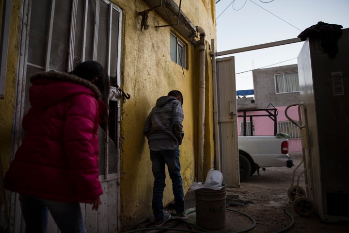 Lorena’s children play outside in Juarez, Mexico after spending the day traveling from southern Mexico to seek asylum in the United States on November 28, 2018. (Photo: Adria Malcolm for Yahoo News)