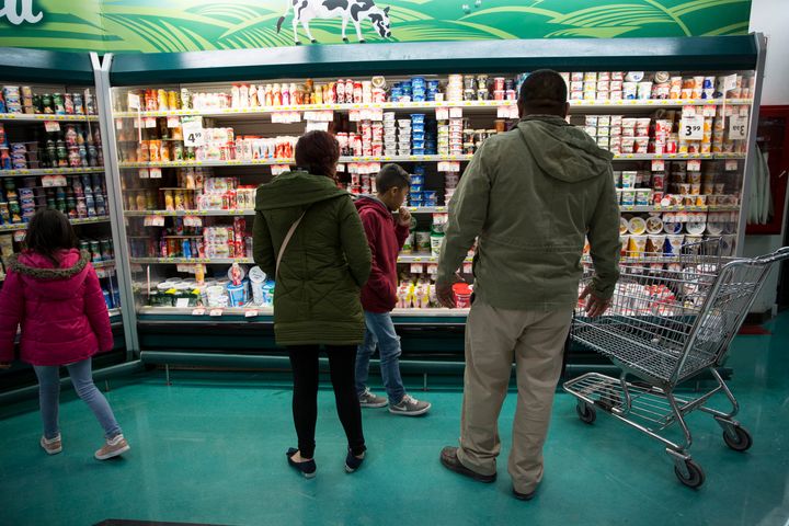 Lorena and her children shop at the grocery store with Alex Varela to buy food for the temporary home they are staying at until their numbers are up on the waiting list in Juarez, Mexico on November 28, 2018. (Photo: Adria Malcolm for Yahoo News)