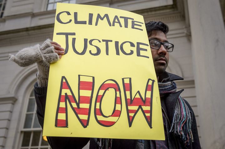 Protesters at City Hall in New York on Nov. 28 called on the city to divest public money from banks that fuel climate change. The largest source of greenhouse gas emissions from human activities in the U.S. is burning fossil fuels.
