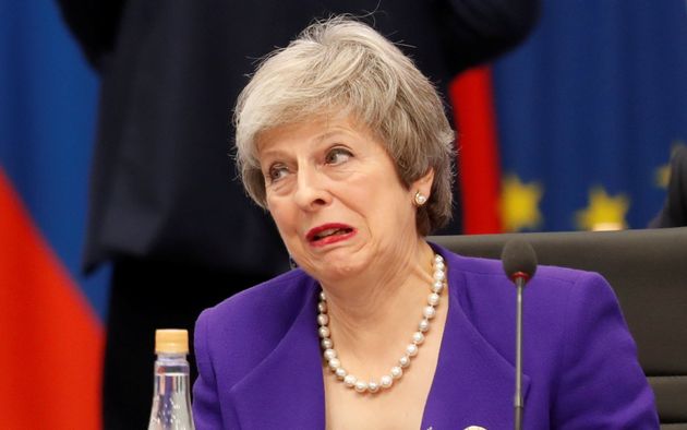 Theresa May reacts during a conversation with US President Donald Trump at Friday's G20 summit session in Argentina.