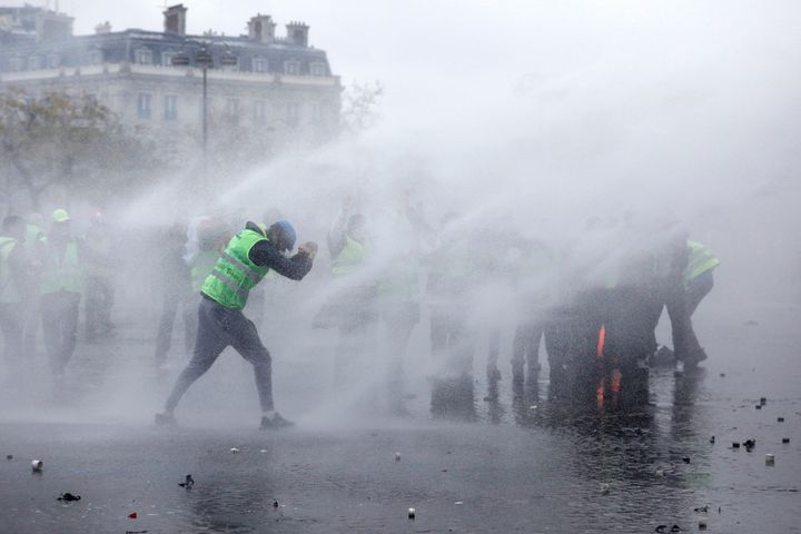 Pictures from Saturday's disturbances showed the use of water cannon by police in Paris.