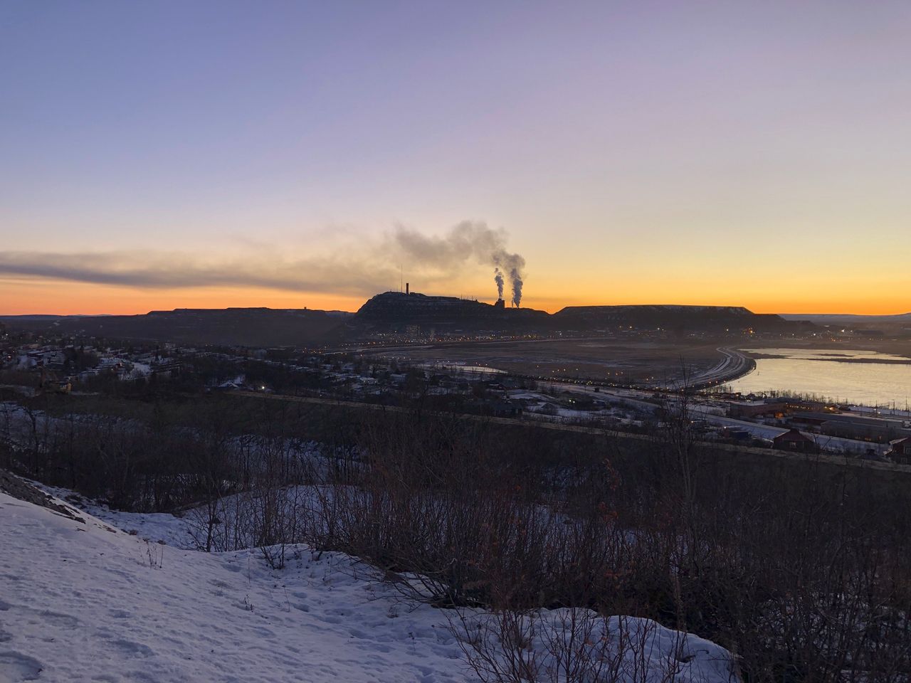 Plumes of smoke rise from LKAB's iron ore mine in Kiruna, Sweden. 