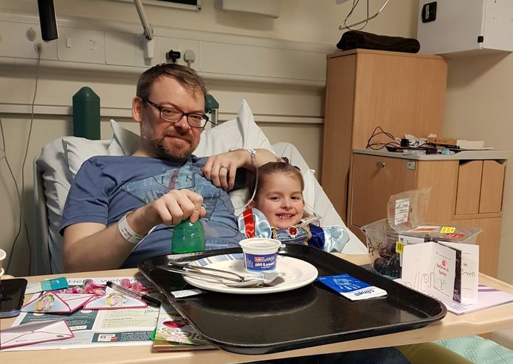 Carl Horrobin with his daughter Alana while he was in hospital