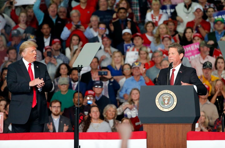 Then-candidate for governor Brian Kemp (R) at a campaign rally with President Donald Trump on Nov. 4 in Macon, Georgia. Kemp won a narrow victory over Democratic candidate Stacey Abrams, amid accusations that he used his position as secretary of state to his advantage. 