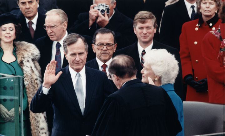 The late President Bush takes the oath of office on Jan. 20, 1989.