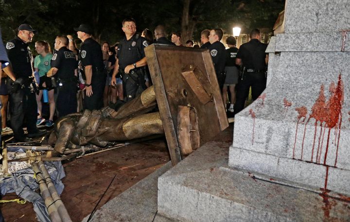 Silent Sam lies on its side after protesters toppled the Confederate monument on Aug. 20.