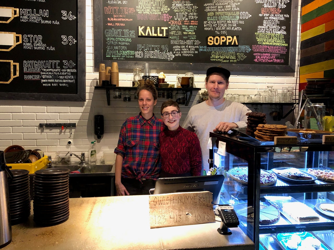 Jessica Schock, center, 28, with her co-workers at Bjöhrns Cafe in Kiruna, Sweden.