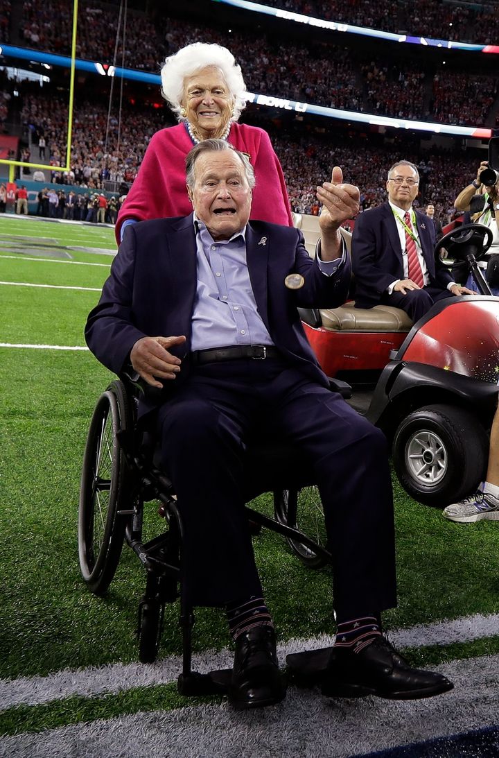 Former President George H.W. Bush and wife, Barbara, walk off the field before the NFL Super Bowl 51 football game between the Atlanta Falcons and the New England Patriots Sunday, Feb. 5, 2017, in Houston. (AP Photo/David J. Phillip) 