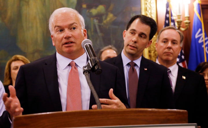 Wisconsin state Senate President Scott Fitzgerald (left), Gov. Scott Walker (center) and Assembly Speaker Robin Vos -- all Republicans -- have led an effort to rein in the powers of statewide offices that Democrats won from the GOP in November.