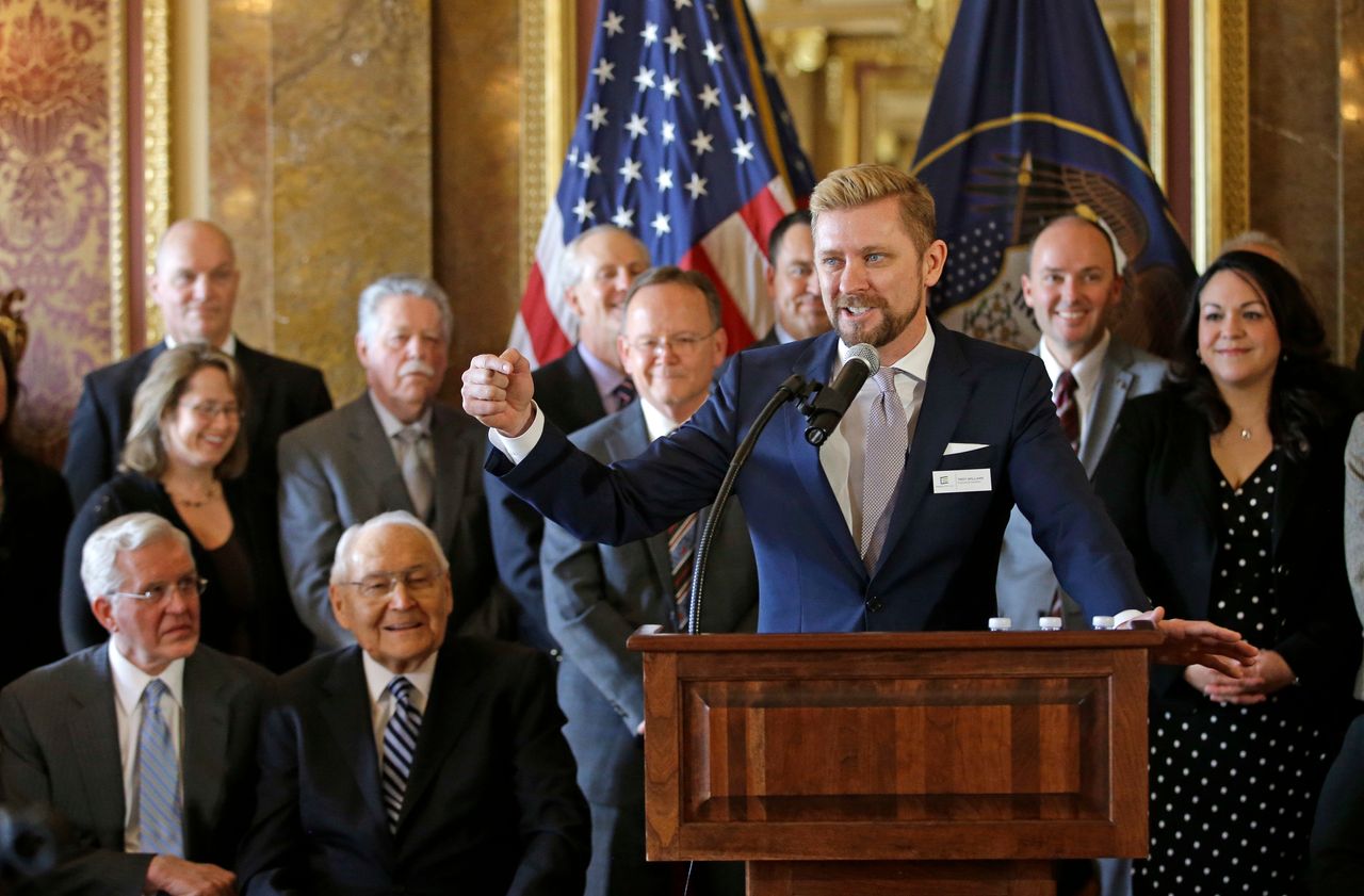 Equality Utah Executive Director Troy Williams (right) speaks after Utah lawmakers introduced a landmark anti-discrimination bill that protects LGBTQ individuals while also carving out protections for the Boy Scouts of America and religious groups during a news conference at the Utah Capitol on March 4, 2015, in Salt Lake City.