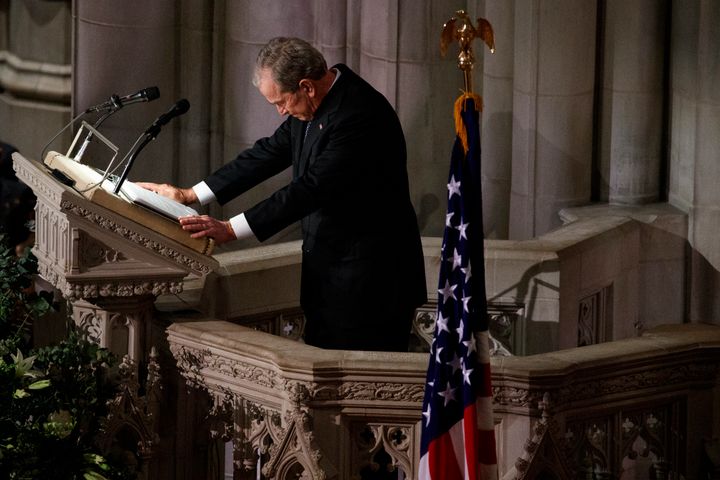 Former President George W. Bush fights back tears as he speaks during the state funeral for his father, former President George H.W. Bush, at the National Cathedral in Washington on Wednesday.