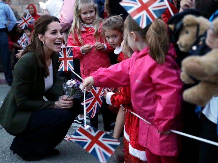 Saying hello to little royal fans with flags! 