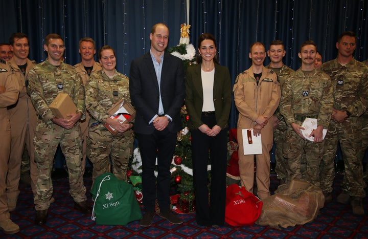 Prince William, Duke of Cambridge and Catherine, Duchess of Cambridge visit military personnel and hand out gifts.