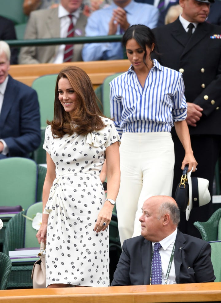 Catherine, Duchess of Cambridge and Meghan, Duchess of Sussex attend Day 12 of the Wimbledon Tennis Championships on July 14, 2018 in London,