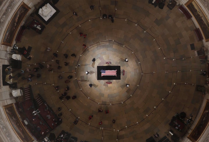 Members of the public are seen inside the Capitol Rotunda as former President George H.W. Bush lies in state on Wednesday ahe