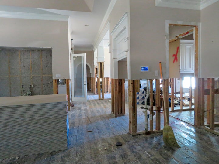 A family rebuilds a flooded home after Hurricane Harvey in Texas.