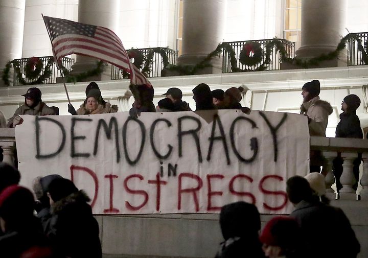 Protesters have gathered at the Wisconsin state capitol in recent days to protest a power grab aimed at undercutting Democrats by the GOP-controlled lame duck Legislature.