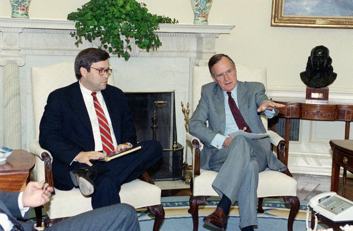 William Barr, left, is seen in 1992 with President George H.W. Bush when Barr was serving as U.S. attorney general.