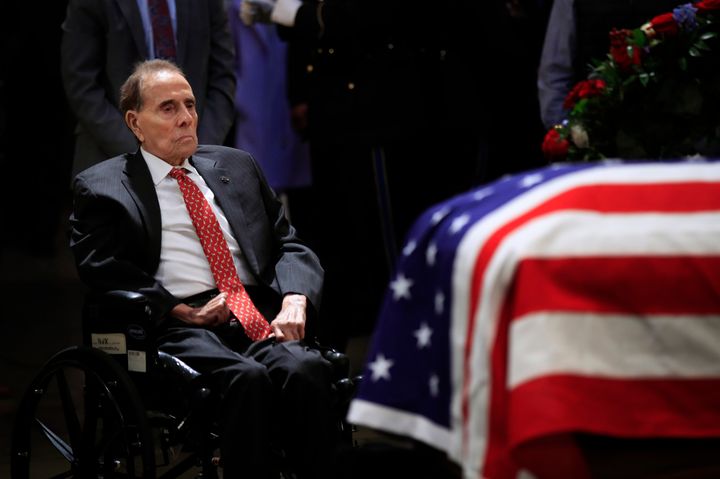Dole pays his last respects to former President George H.W. Bush, his 1988 rival for the presidential nomination, at the Capitol in Washington in December 2018.