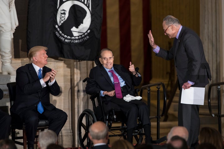 Dole (center), flanked by President Donald Trump (left) and Senate Minority Leader Chuck Schumer is honored at the Capitol with a Congressional Gold Medal on Jan. 17, 2018.