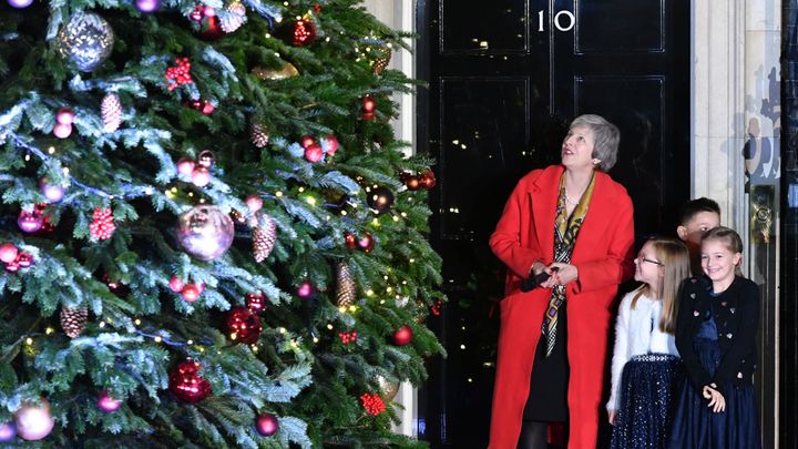 Theresa May will children turning on the Christmas lights in Downing Street