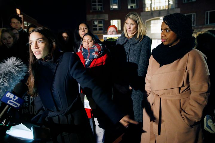 Rep.-elect Alexandria Ocasio-Cortez, D-N.Y., left, speaks at a small rally outside an orientation meeting for incoming members of Congress at Harvard University as Rep.-elect Ayanna Pressley, D-Mass., right, and Rep.-elect Lori Trahan, D-Mass., second from right, look on in Cambridge, Dec. 4, 2018. 