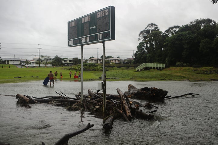 Floodwaters surround a baseball scoreboard during flooding from Tropical Storm Lane on the Big Island, in Hilo, Hawaii. 