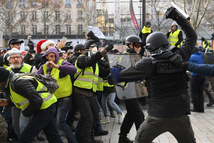 Riot police clash with French protesters Saturday.